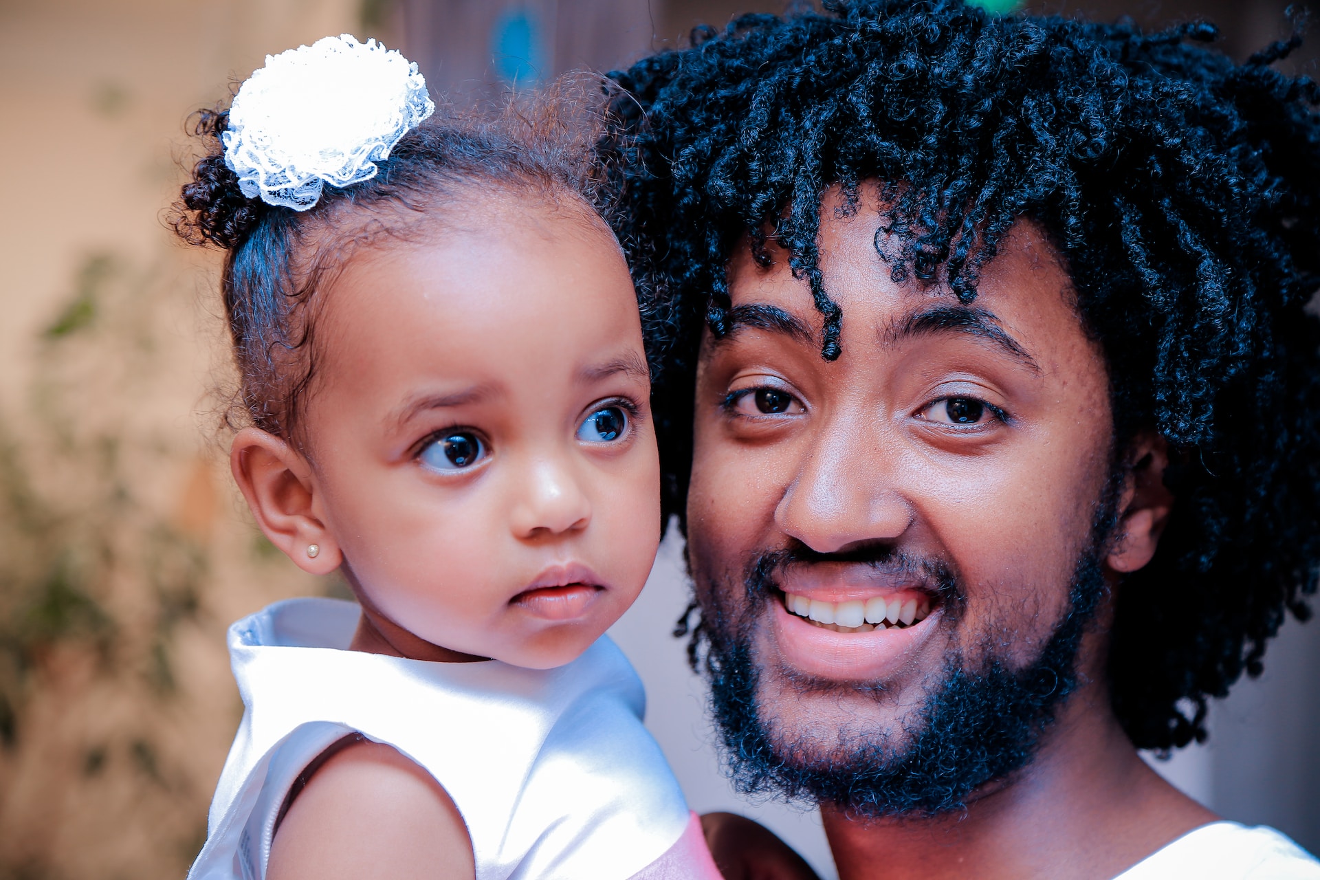 Father smiling with daughter.